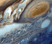 False-color detail of Jupiter's atmosphere, imaged by Voyager 1, showing the Great Red Spot and a passing white oval