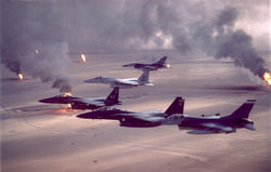USAF aircraft (F-16, F-15C and F-15E) fly over Kuwaiti oil fires, set by the retreating Iraqi army during Operation Desert Storm in 1991.