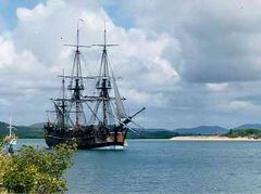 Lieutenant James Cook charted the East coast of Australia on HM Bark Endeavour, claiming the land for Britain in 1770. This replica was built in Fremantle in 1988; photographed in Cooktown harbour where Cook spent seven weeks.