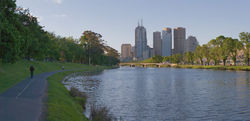 Melbourne's Yarra  River is a popular area for walking, jogging, cycling, rowing and for relaxing on the banks with a picnic