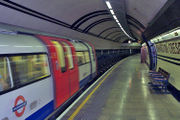 A London Underground 1995 Stock train pulls into Mornington Crescent station on the Northern Line.