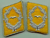 Collar tabs of a major in the Luftwaffe (1935–1945). The background colour denotes officers were in the flying divisions of the Luftwaffe. Other divisions, such as anti-aircraft artillery (Flak) had patches with different coloured backgrounds.