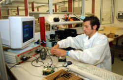 A Maltese worker producing system components for wireless communication.