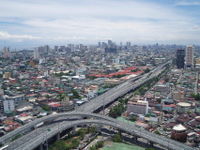 Aerial view of Manila with the South Luzon Expressway in the foreground.