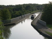 the Grand Union Canal passes between Bradwell and New Bradwell via the Bradwell Aqueduct
