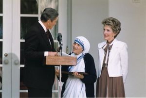 President Ronald Reagan presents Mother Teresa with the Medal of Freedom at a White House ceremony, 1985.