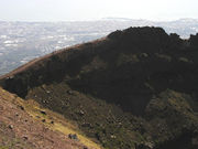 View of the [crater] wall of Vesuvius, with Naples in the background