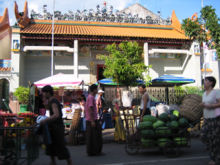 Goods in urban areas are often transported by coolies, as seen in Yangon's Chinatown.