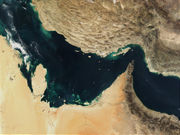 Satellite image showing the Persian Gulf, the Strait of Hormuz is the dramatic constriction on the right third.