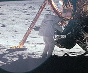 Neil Armstrong works at the LM in one of the few photos showing him during the EVA