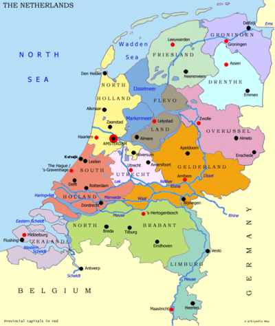 Map of the Netherlands, with red dots marking the capitals of the provinces and black dots marking the large cities. The national capital is Amsterdam, and the national seat of government is The Hague (Den Haag)