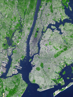 Satellite image showing most of the five boroughs, portions of eastern New Jersey, and the main waterways around New York harbor.