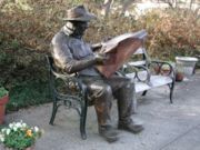 Reading the newspaper: Brookgreen Gardens in Pawleys Island, South Carolina, United States.