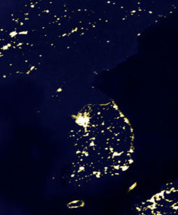 A satellite photo of the Korean Peninsula at night illustrates the large differences between North Korea and its southern neighbour.