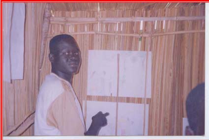 A former child soldier displays his drawings