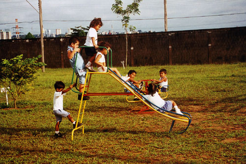 SOS Children in Brazil playing on a slide